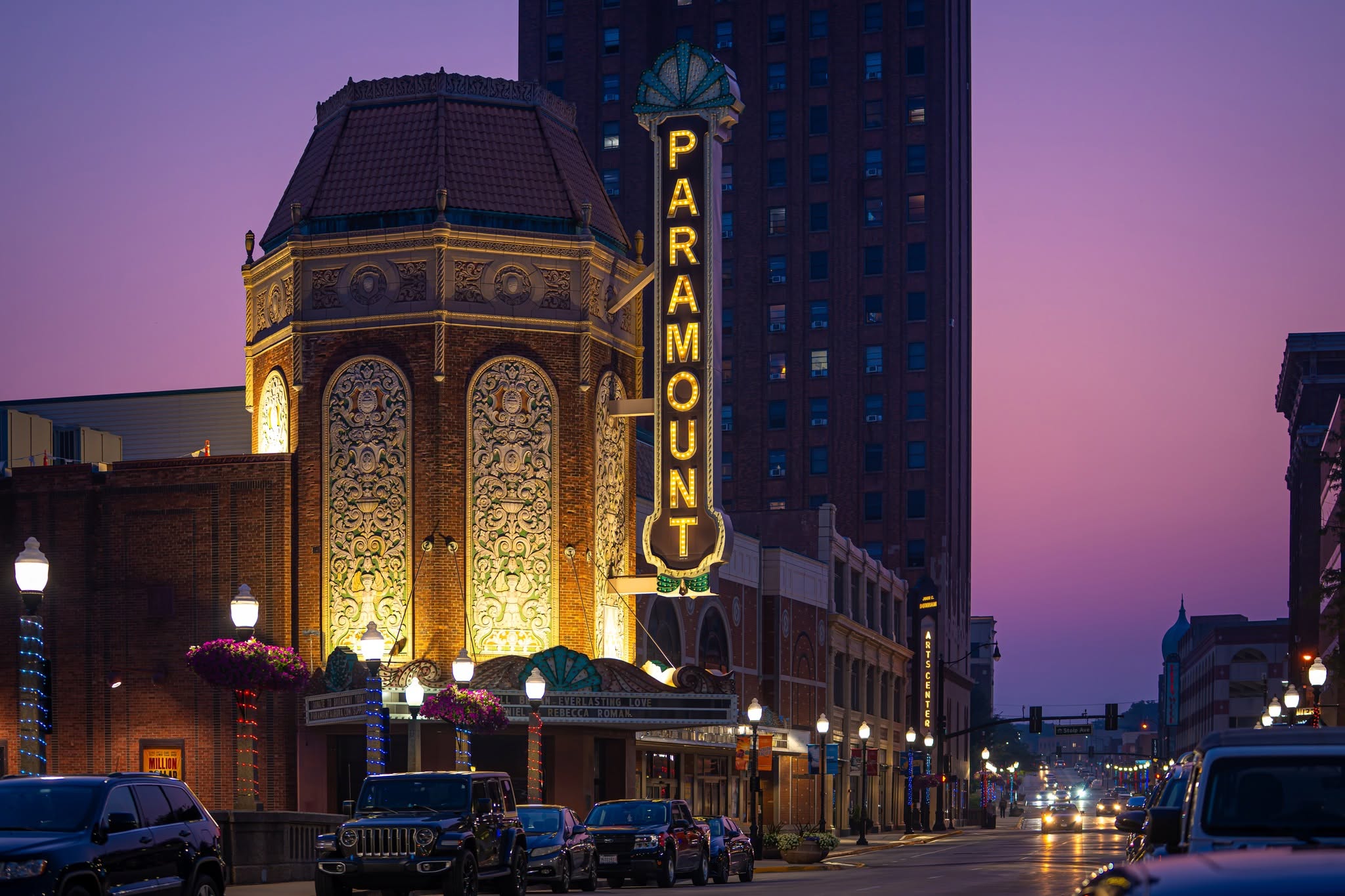 The Paramount Theatre marquee lit at dusk in downtown Aurora
